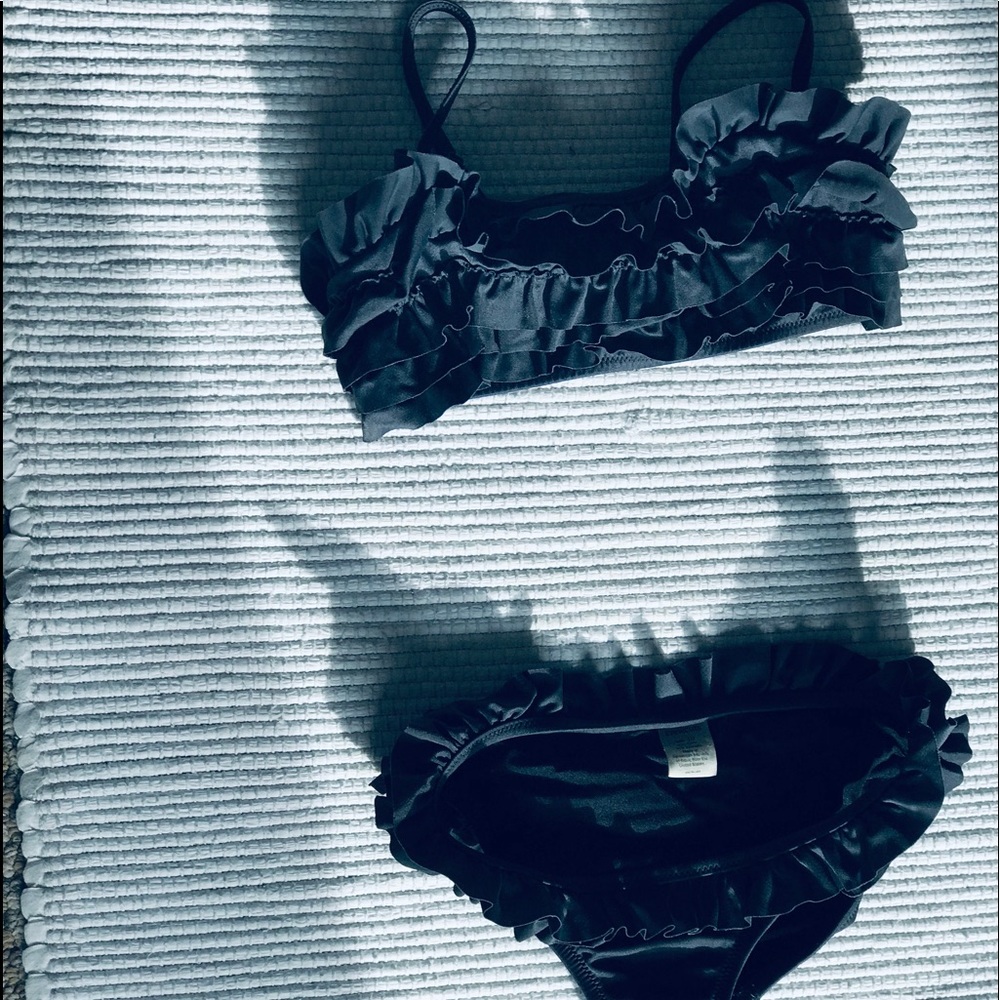 Black ruffled bathing suit.